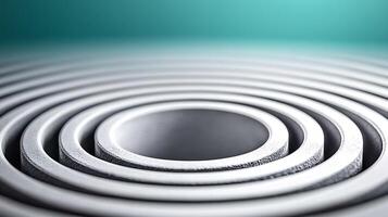 Close-up of concentric metallic rings with a central hole, set against a softly blurred background photo