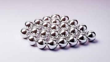 A cluster of shiny metallic spheres arranged artistically against a soft gradient background photo