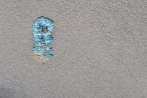 Bad work. Hole in the plastered wall from fallen plaster photo
