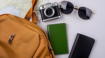 Travel Essentials A Camera, Sunglasses, and Wallets on a Map Background for Adventure Planning photo