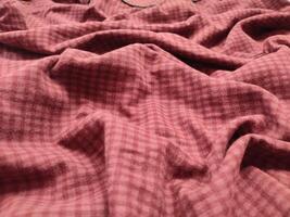 The background and pattern of the fabric is a seamless alternating red checkered material photo