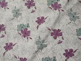 Seamless floral fabric pattern motifs and background with summer and autumn flowers photo