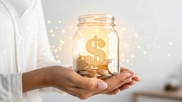 person holding glowing jar filled with coins and dollar symbol, symbolizing wealth accumulation and financial growth. image conveys sense of prosperity and savings photo