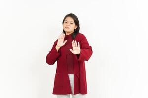 Asian woman making stop gesture with hands photo