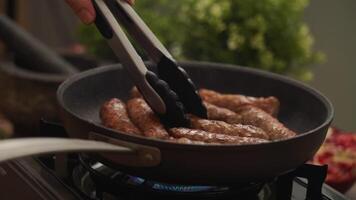 Homemade sausages frying in pan. video