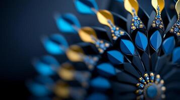 Close-up of an intricate blue and gold decorative design with shimmering details on a dark background photo