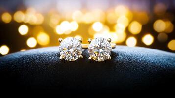 Close-up of elegant diamond earrings on a soft surface with a blurred golden bokeh background photo