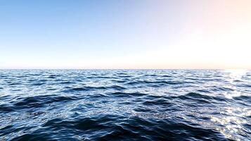 Serene ocean view at sunset with gentle waves under a clear sky, perfect for relaxation photo