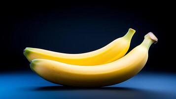 Two ripe bananas resting on a blue surface with a soft gradient background, ideal for food imagery photo