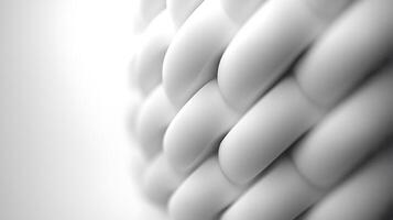 Close-up of intricately woven white material creating a textured surface with soft lighting photo