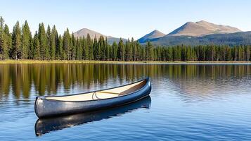 Serene canoe floating on a calm lake surrounded by majestic mountains and lush forests photo