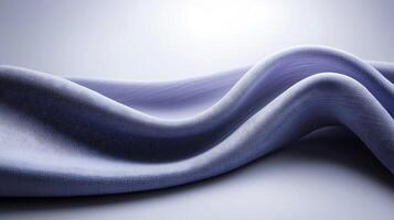 Soft, flowing fabric draped elegantly, showcasing gentle curves and smooth texture in a minimalistic setting photo