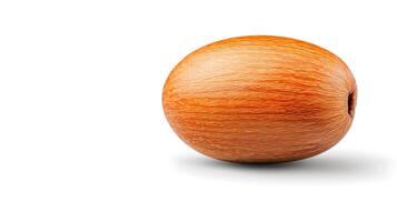 Smooth, oval-shaped nut with a light brown wooden texture resting on a white background photo