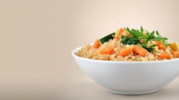 A vibrant bowl of quinoa salad with colorful vegetables on a soft beige background photo