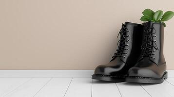 Black boots with green plants emerging, set against a minimalist beige background photo