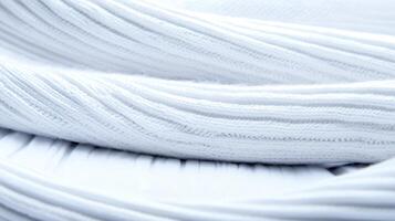 Close-up view of soft white fabric layers showcasing texture and smoothness, ideal for fashion design photo