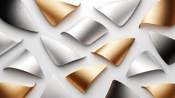 Abstract arrangement of metallic shapes in gold and silver tones on a light background photo
