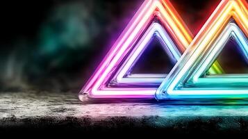 Colorful neon triangles glowing on a dark background, creating a vibrant visual effect photo