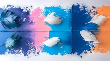 Vibrant abstract composition with colorful paint splashes and delicate feathers arranged artistically photo