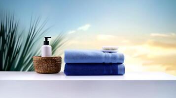Serene spa setting with stacked towels, a lotion bottle, and a brush against a tranquil sky backdrop photo