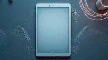 A modern tablet resting on a textured blue surface with soft lighting, ideal for tech showcases photo