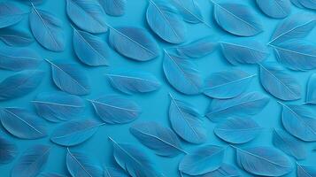 A vibrant arrangement of blue leaves on a turquoise background, creating a serene atmosphere photo