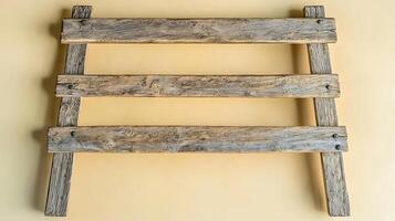 Rustic wooden fence panel against a soft yellow background, ideal for home decor or design projects photo