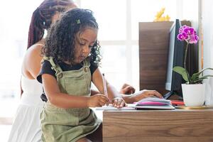 work at home. Colombian family Togetherness. Mother-Daughter photo