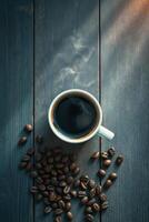 Steaming cup of black coffee with coffee beans on dark wooden table photo