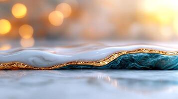 Close-up of a beautifully crafted resin art piece with gold accents and soft bokeh background photo