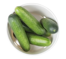 Several freshly picked cucumbers lying in white cardboard packaging, top view of fresh garden vegetables ready for culinary use isolated on transparent background, png