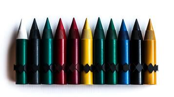 A vibrant collection of colored crayons arranged neatly on a white background, ideal for art projects photo
