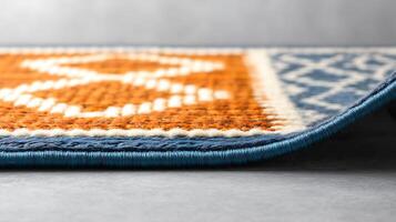 Close-up view of a vibrant patterned rug with intricate designs and textures on a neutral background photo