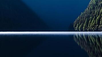 Serene twilight over a tranquil lake surrounded by dense evergreen forests reflecting in water photo