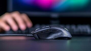 Close-up of a sleek gaming mouse on a desk with a blurred background of a colorful screen photo
