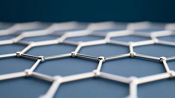 Close-up view of a metallic hexagonal structure showcasing intricate patterns and reflections photo