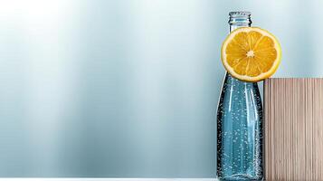Refreshing sparkling water bottle with lemon slice, wooden block, and soft blue background photo