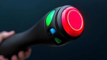 Close-up of a hand holding a multi-colored button device against a dark background photo
