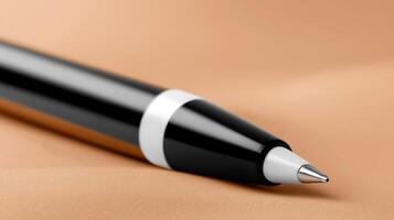 Close-up of a sleek black pen resting on a smooth surface, highlighting its design and elegance photo