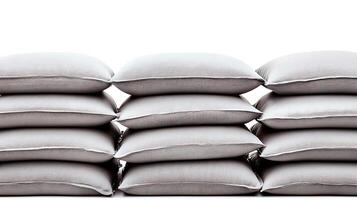 Stacked pillows in a minimalist setting, showcasing texture and arrangement for home decor photo