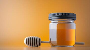 A close-up of a honey jar with a wooden dipper against an orange gradient background photo