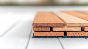 Close-up view of stacked wooden planks on a white surface, showcasing textures and colors photo
