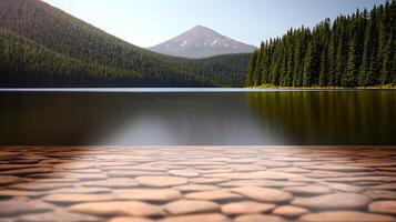 Serene lake view with smooth pebbles in foreground, surrounded by lush forest and mountain backdrop photo