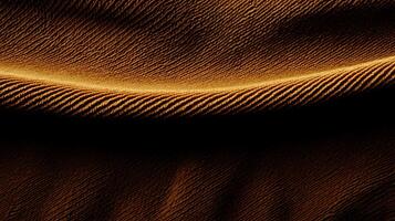 Close-up of flowing golden fabric showcasing elegant texture and soft shadows photo