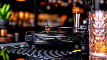 Close-up of a vintage turntable playing a record in a dimly lit bar with vibrant background lights photo