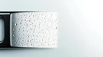 Close-up of a sleek metallic surface with water droplets, showcasing modern design and freshness photo