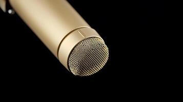 Close-up view of a gold microphone against a black background, highlighting its design and texture photo