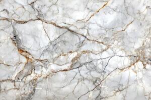 White marble texture with golden and gray veins creating natural pattern photo