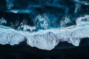 Ocean waves crashing on black sand beach, aerial view of nature's power photo