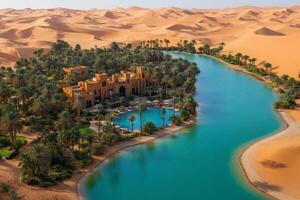 Luxurious hotel resort surrounded by palm trees and artificial lake in empty quarter desert, liwa oasis, abu dhabi, united arab emirates photo